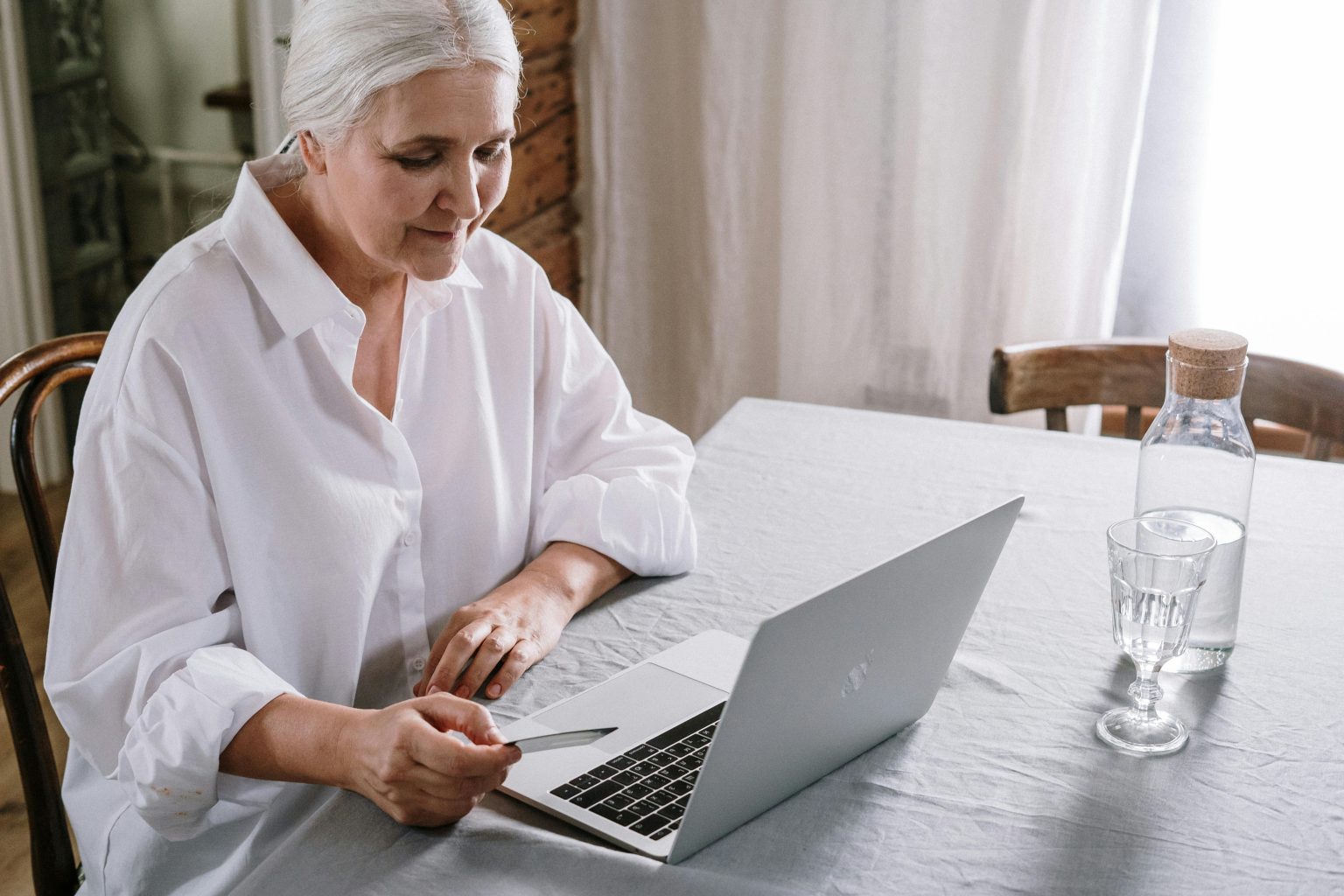 Elderly lady using a laptop